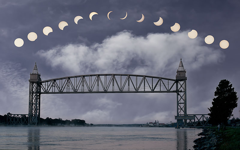 Cape Cod Railroad Bridge beneath an arc of solar eclipse phases